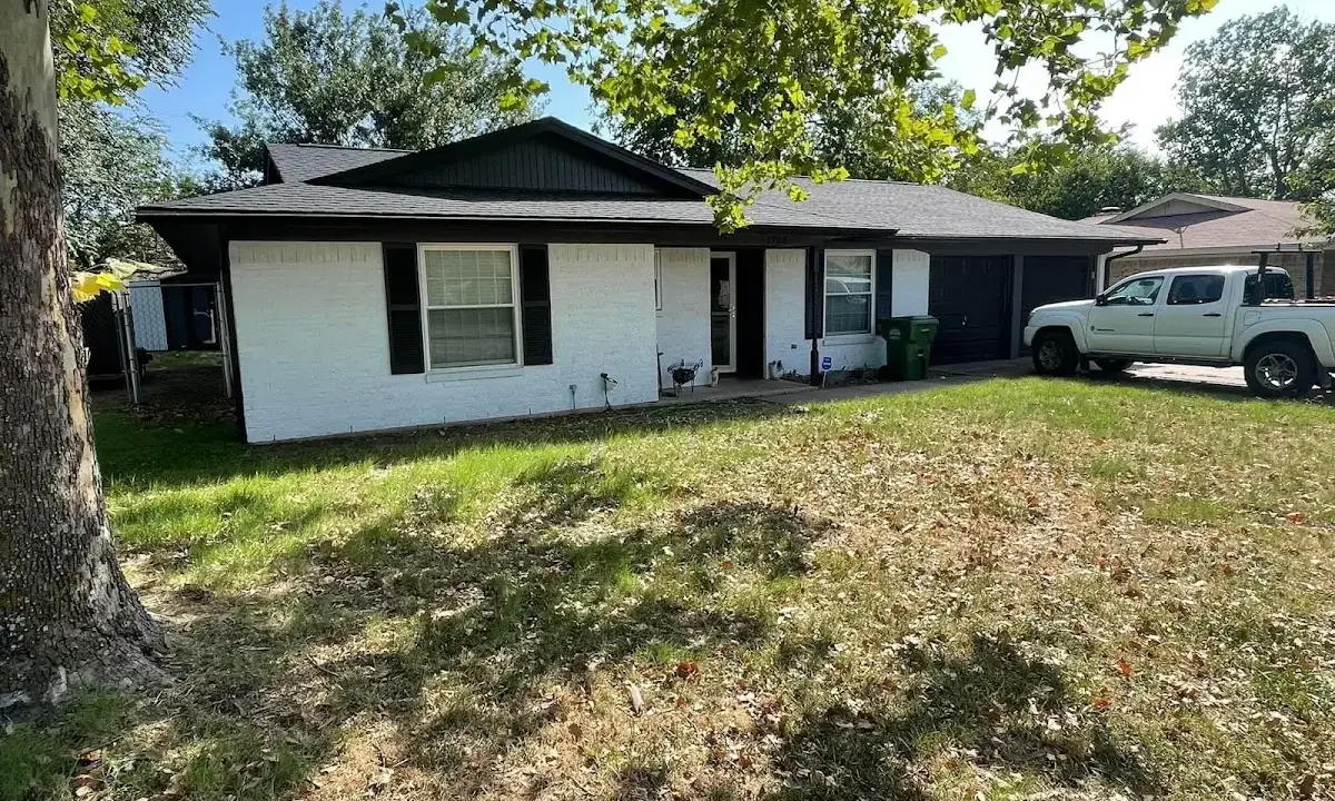 Professional roofing crew working on a residential roof in Litchfield